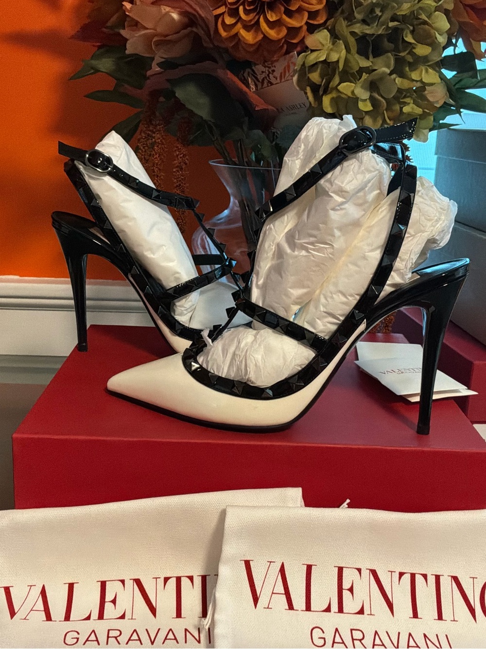 Valentino Garavani Black-Trimmed White Rockstud Patent Pumps